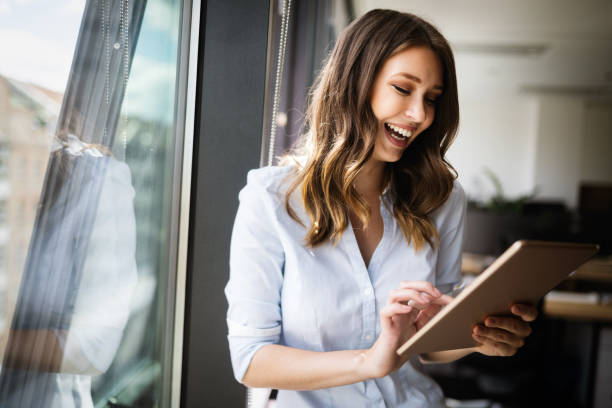 istock Successful business woman looking confident and smiling 1129331261
