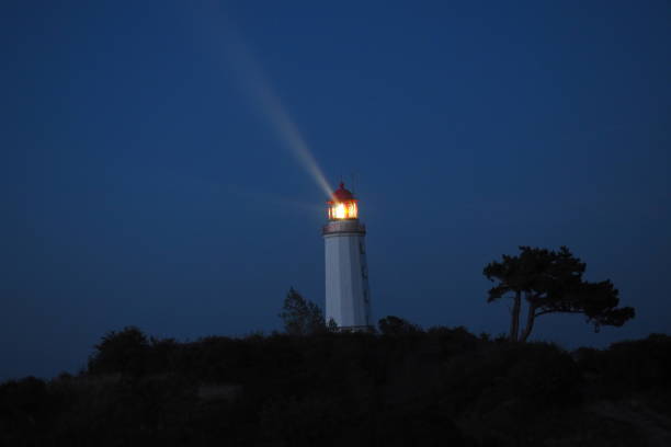 Ray from the darkness, Hiddensee, lighthouse, at night the lighthouse of Hiddensee shines licht stock pictures, royalty-free photos & images
