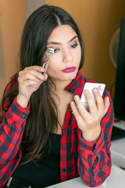 istock Young Woman Doing Make-up at the Home 1129331827