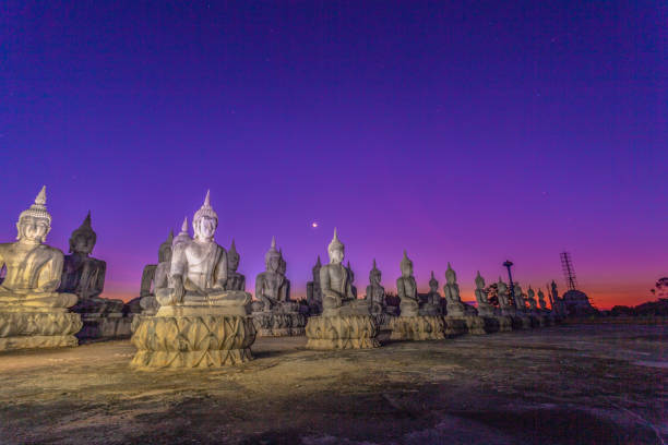 istock a lot of Buddha statues in twilight 1129332474