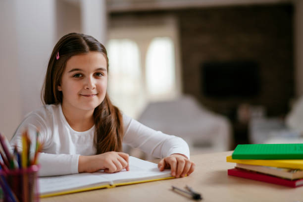 istock Happy little girl studying 1129332715