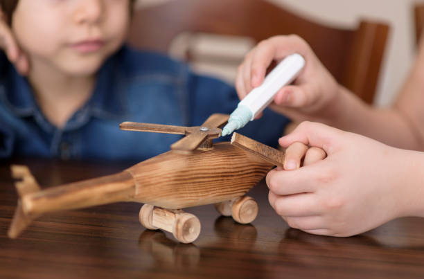 children crafting wooden toys children crafting wooden toys broken toy stock pictures, royalty-free photos & images