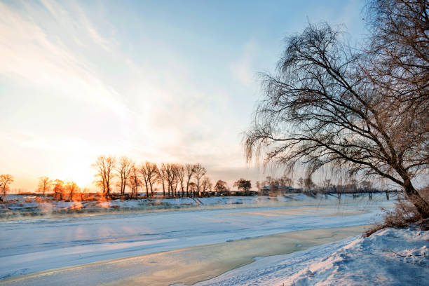 istock Winter landscape with frozen lake 1129334463