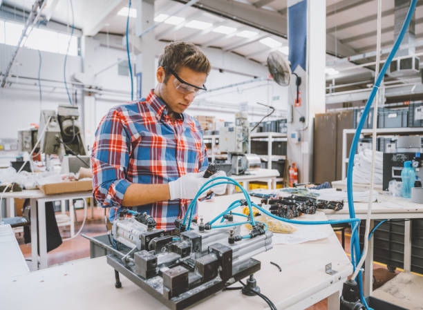 istock Manual worker man working at manufacturing factory 1129334689
