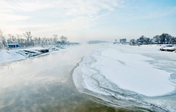 istock Winter landscape with frozen lake 1129335328