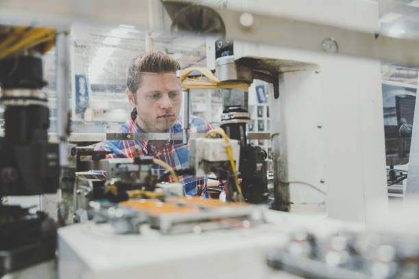 istock Manual worker man working at manufacturing factory 1129335781
