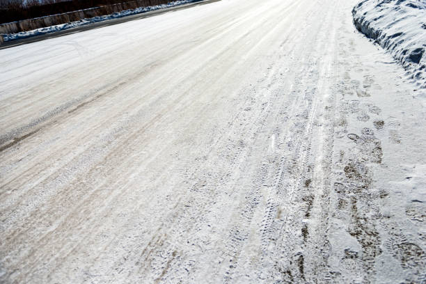 istock Tires trails on the snow road 1129339072