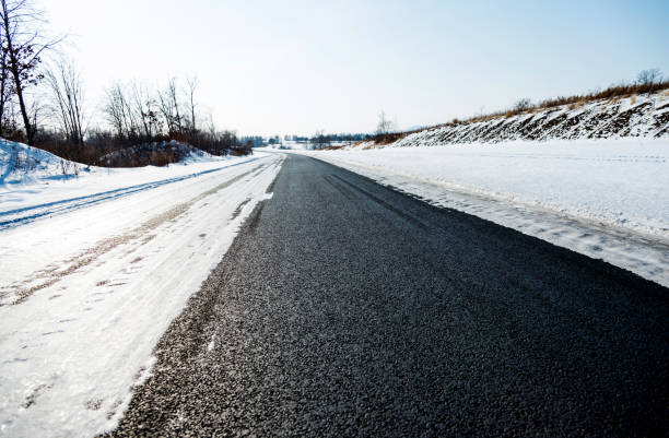 istock Country road covering with snow 1129339236