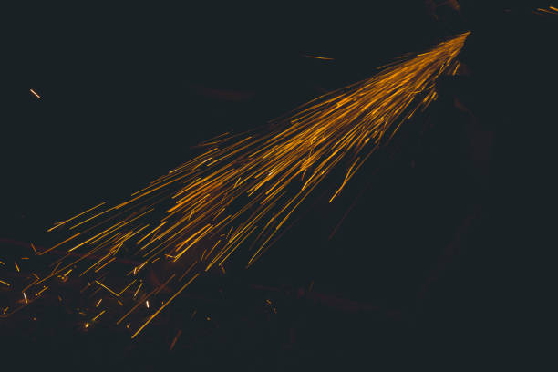 Sparks while cutting steel in the factory for background