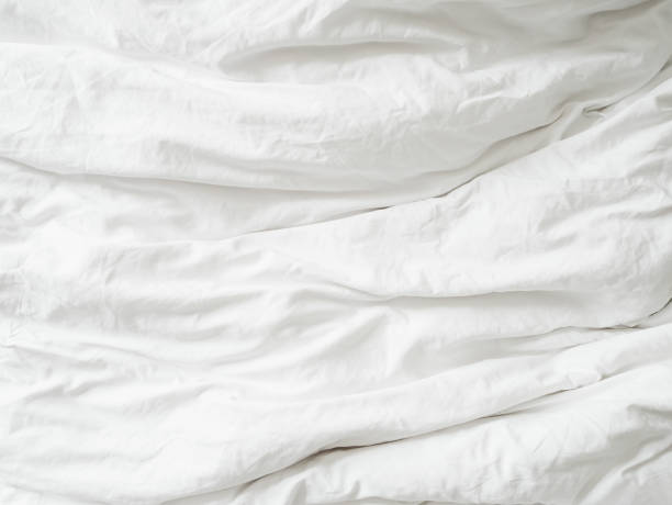 istock White fabic texture wrinkled texture ,Soft focus white fabic crumpled background 1129340355