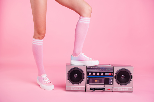 Cropped close up photo skinny perfect ideal she her lady legs standing on boom box play on fitness training happy glad be in fit soundtrack turned on isolated pink rose background