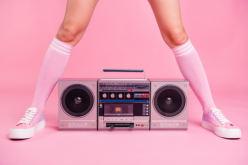 Cropped close up photo skinny perfect ideal she her lady legs opposite standing boom box play between teens hanging out celebrating weekend holiday isolated pink rose background