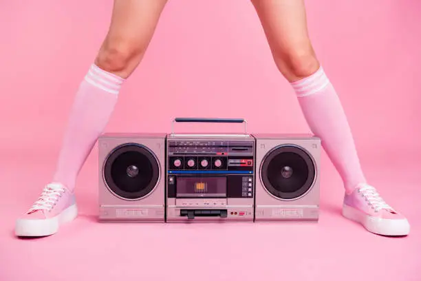 Photo of Cropped close up photo skinny perfect ideal she her lady legs opposite standing boom box play between teens hanging out celebrating weekend holiday isolated pink rose background