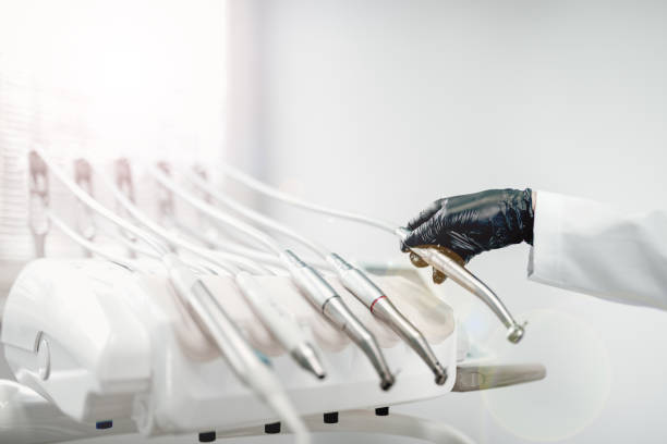 istock Close-up of dentist working with a modern dentist tools. 1129342476