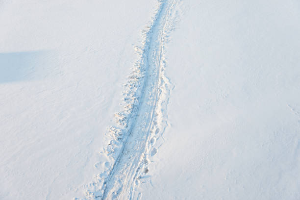 Tire tracks on a snow field.