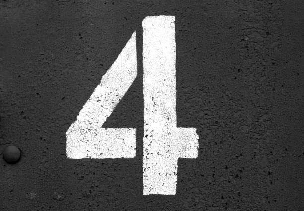 istock Number 4 in stencil on metal wall in black and white. 1129346548