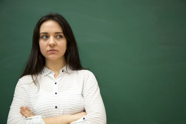 istock Young student in front of blackboard 1129347138