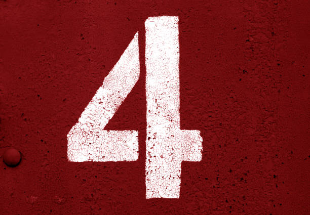 istock Number 4 in stencil on metal wall in red tone. 1129348175
