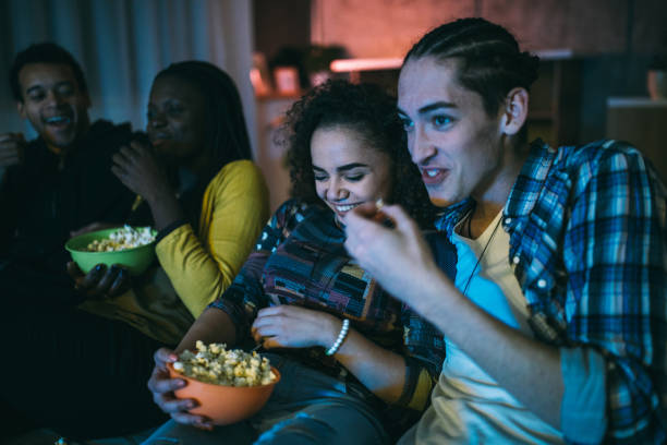 istock Friends watching favorite television show 1129348943