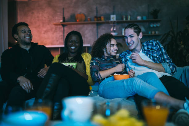 istock Friends watching favorite television show 1129349029