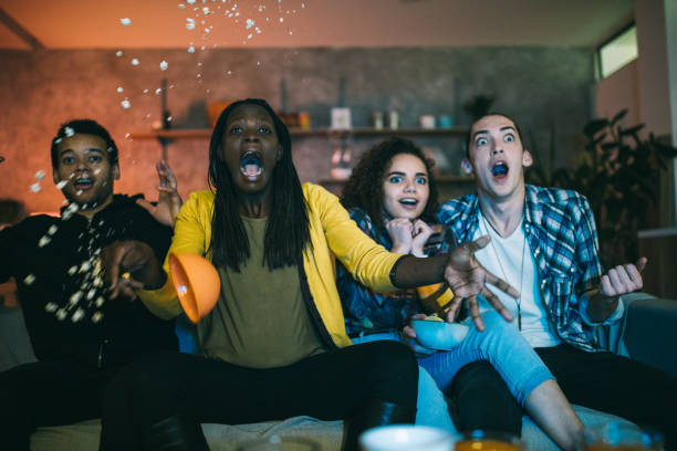 istock Shocked friends watching horror movie 1129349030