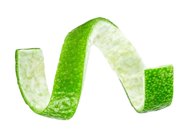 istock Green lemon twist on a white background 1129349133