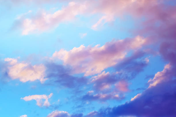 istock blurred image of a beautiful blue sky with clouds at early sunset. 1129349204