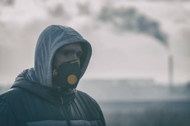 istock wearing a real anti-pollution, anti-smog and viruses face mask 1129353322