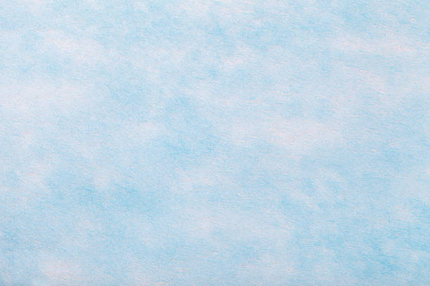 istock Light blue background of felt fabric. Texture of woolen textile 1129356353