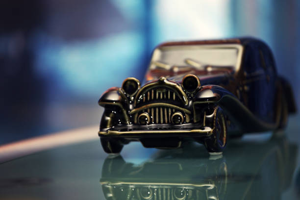 istock retro toy car glass reflection 1129361156