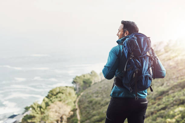 always dare to explore the beauty's nature holds - backpack one mature man only only mature men one man only imagens e fotografias de stock