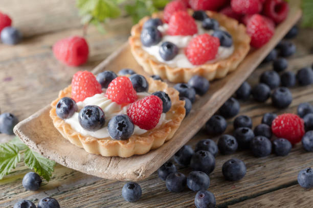 istock Dessert tarts with raspberries and blueberries . 1129364709
