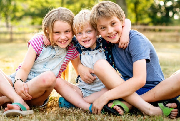 istock Siblings putting their arms around each other 1129365313