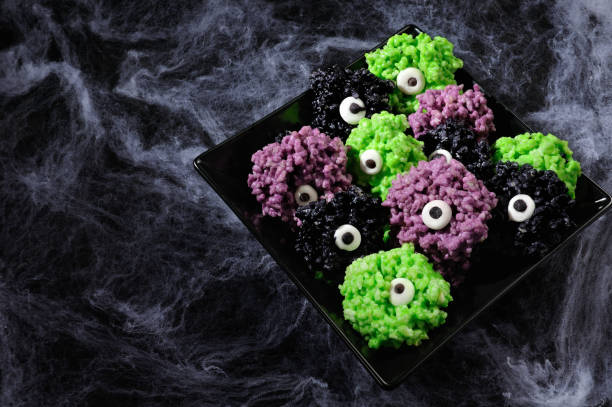 istock Monsters eye balls- made from marshmallows Rice Kris pies bites crispy bite balls. These are delicious, delight have a creepy monster and funny colors of Halloween 1129365557