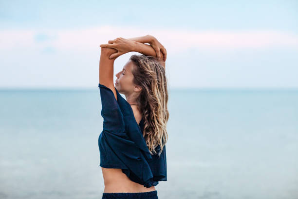 istock Dreamy girl on beach 1129366774