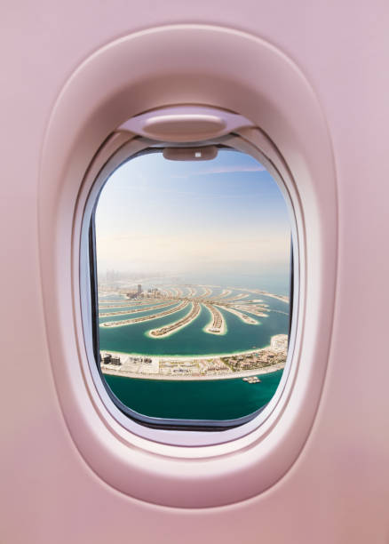 istock Airplane interior with window view of Dubai city 1129366850
