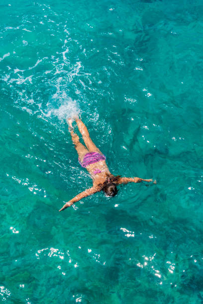 istock Women enjoying swimming. 1129366895