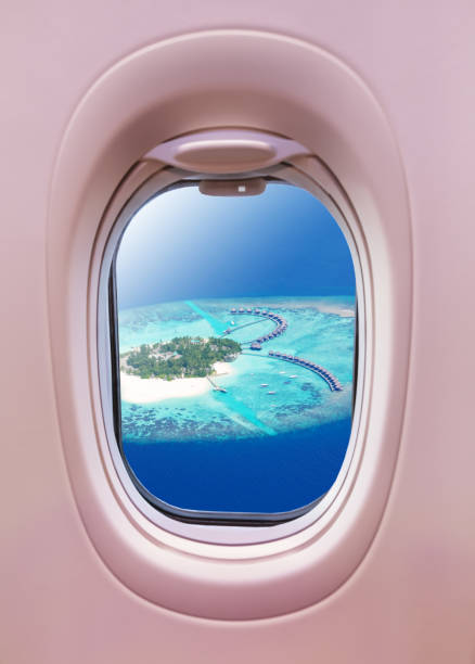 istock Airplane window view of Maldives island 1129366902