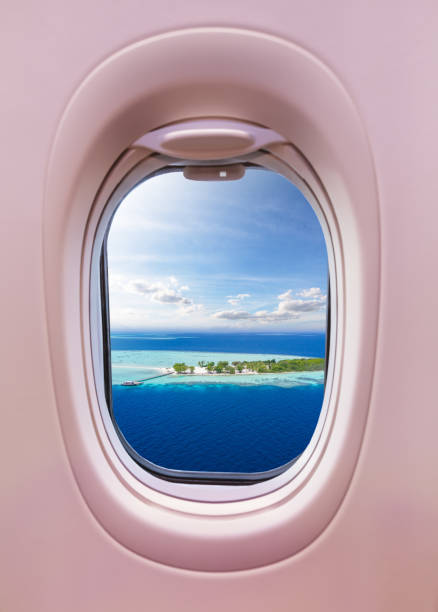 istock Airplane window view of Maldives islands 1129366905