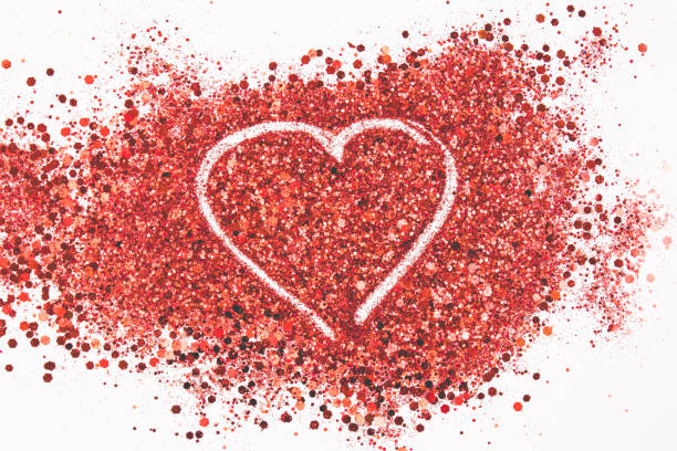 istock Beautiful drawing a heart on a glitters background. Love concept. 1129370321