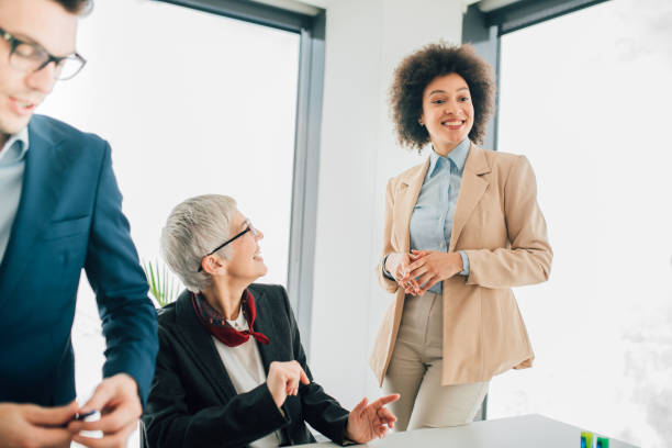istock Happy coworkers at office 1129370458