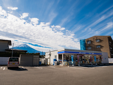 Kawaguchi, Japan - November 1, 2018: Lawson, convenience store franchise chain in Japan with Mount Fuji in background.