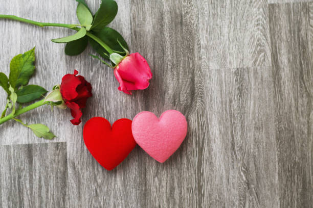 istock rose flower and heart on table background. concept valentine day 1129374149