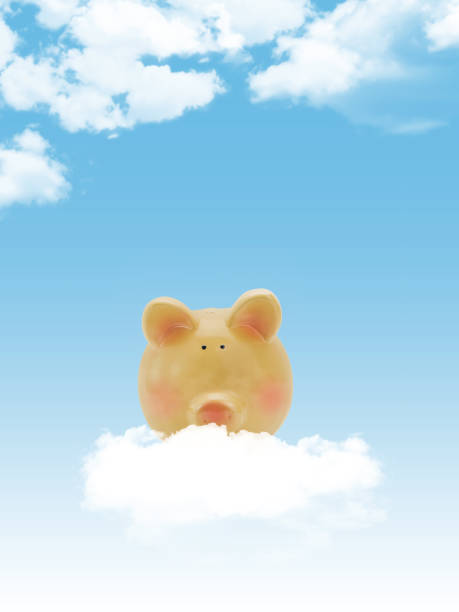 istock Piggy bank with blue sky and clouds, copy-space 1129374546