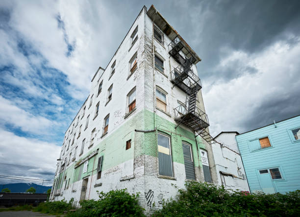 Vancouver, B.C., Canada - June 19, 2012: Rundown empty residential building along Powell Street, Downtown East Side photographed from a low angle