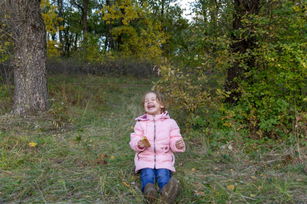 istock Funny child eating pie in the forest 1129377129