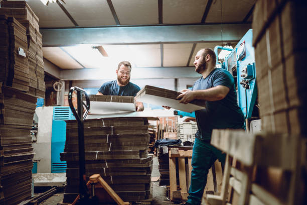 Late Night Cardboard Factory Shift Two Handsome Bearded Males Working at Cardboard Factory Second Shift people laughing hard stock pictures, royalty-free photos & images