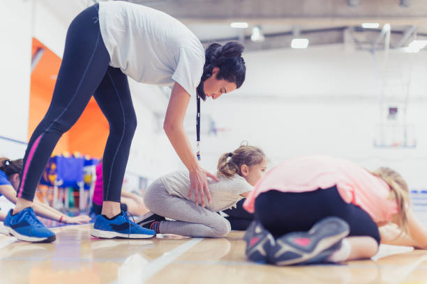 istock Female volleyball team exercising with coach 1129378987