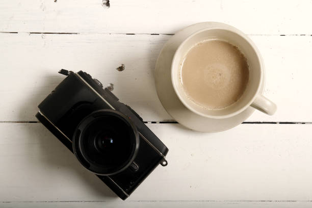 istock Digital mirrorless camera and a cup of coffee 1129379081