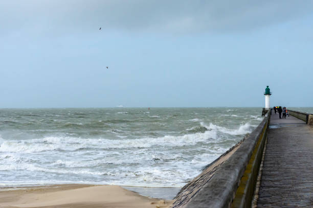 istock Calais France seaside with gale winds with warf 1129379961